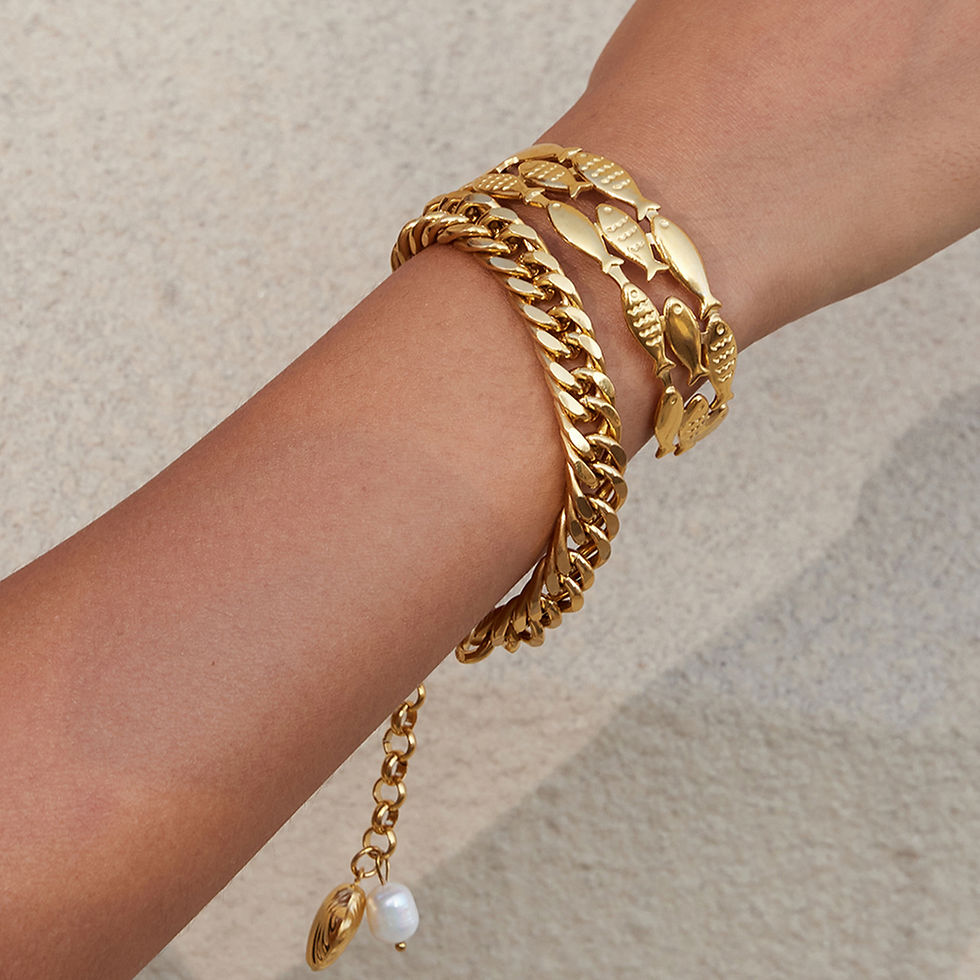 ocean fish bracelet worn on wrist 316L stainless steel gold PVD jewelry lifestyle fashion shot
