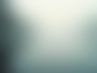 a lake at dusk wiht fog over the water. 