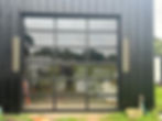 Modern full-view glass garage door professionally installed in Houston , TX