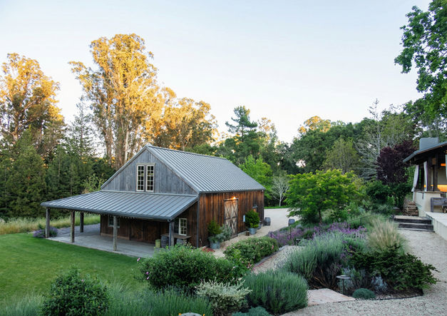 Pavilion overlooking lawn and naturalistic mountainside garden.