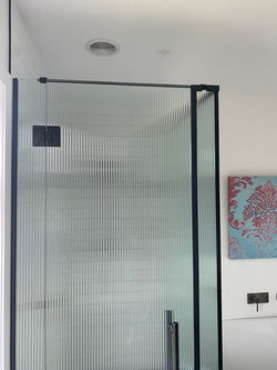 Narrow reeded shower glass