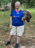 Volunteer Charlona with Brazos the barred owl