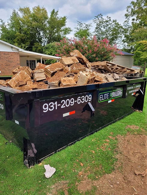 rolloff dumpster full of wood