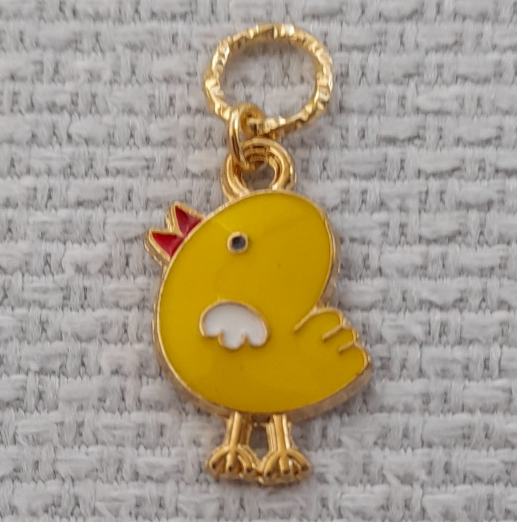Yellow baby bird charm made into a stitch marker