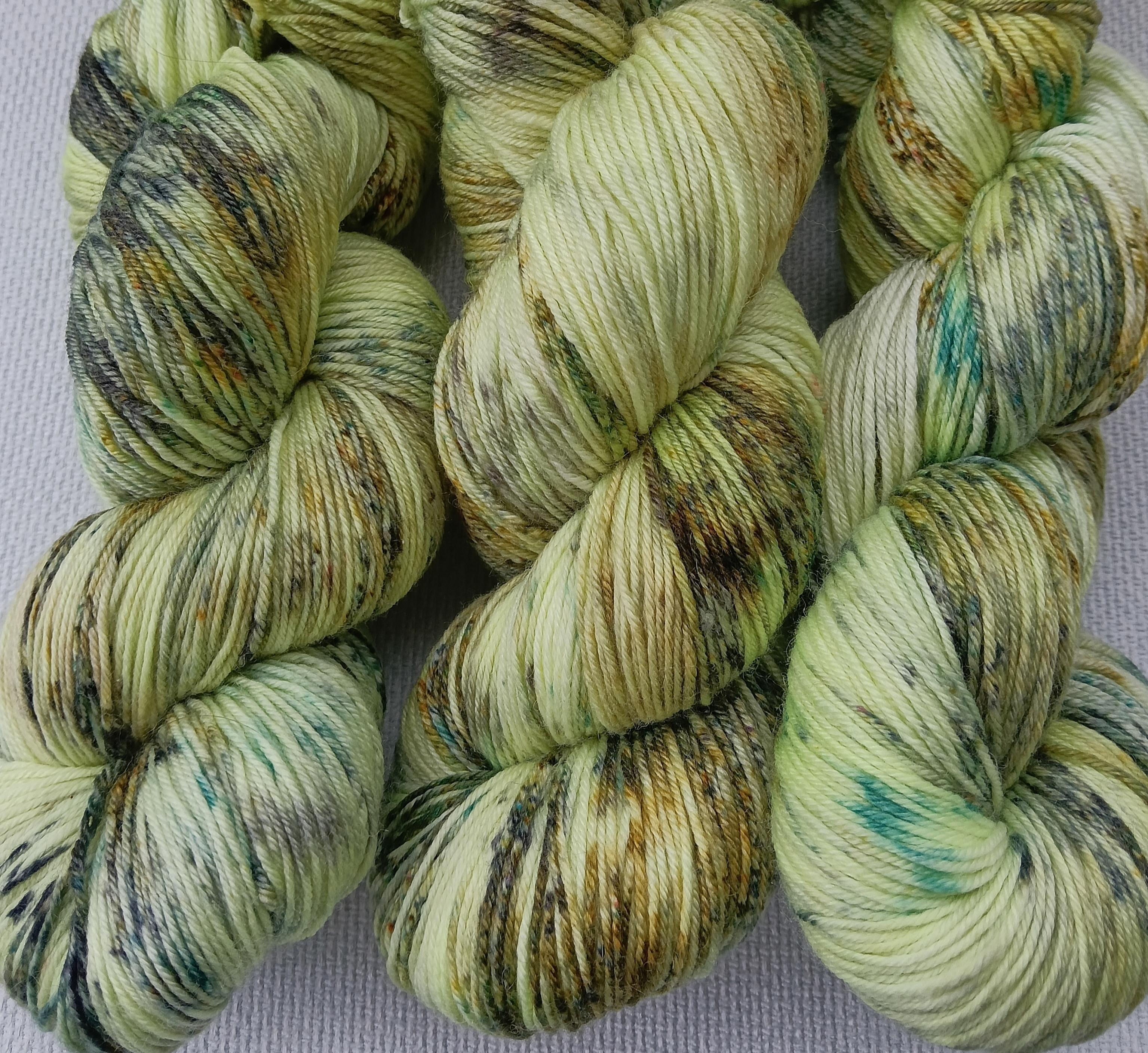 Many different greens shades hand dyed onto a light limey lemon yarn base.