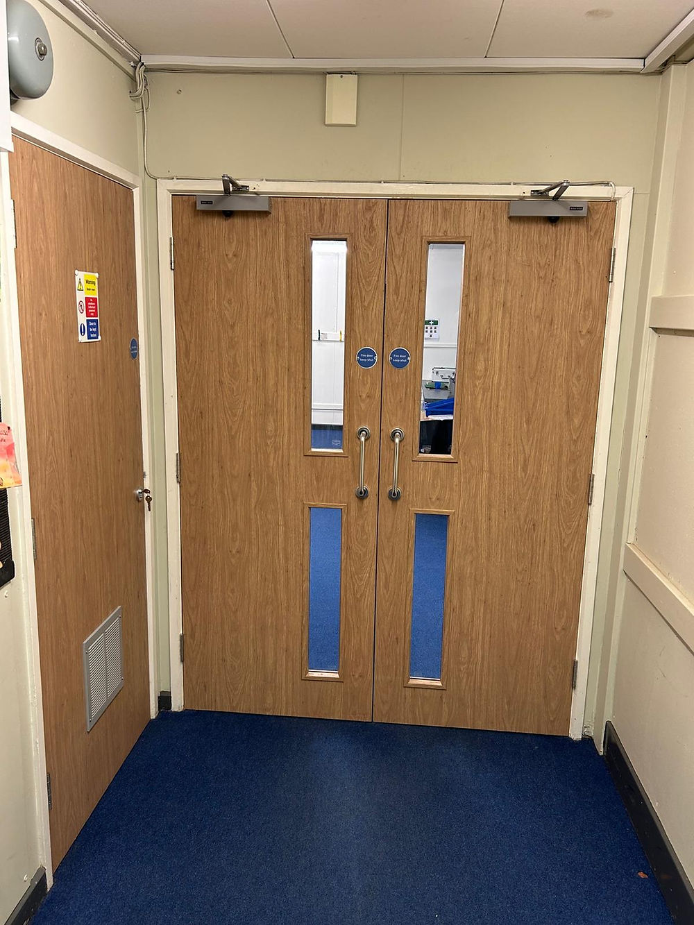 Double wooden doors in hallway