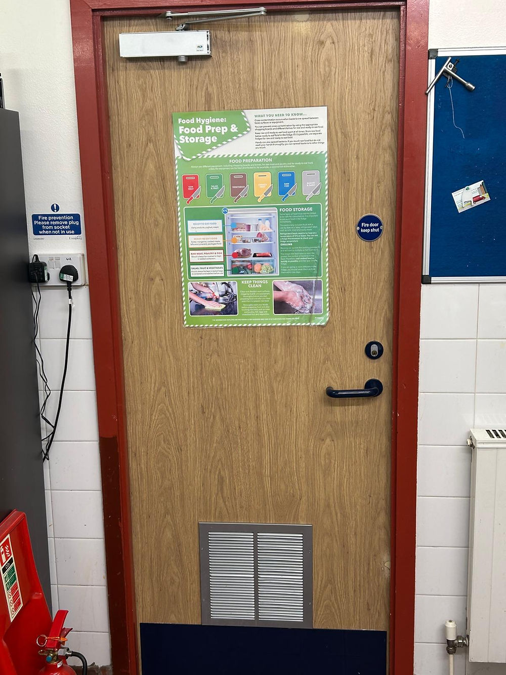 Wooden door with red frame and poster, common for property maintenance