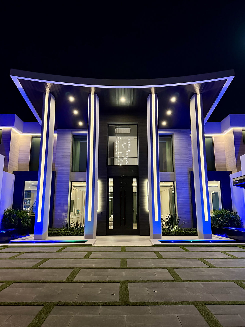 Large, modern house with extravagant lighting