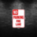 no parking fire lane sign in red and white