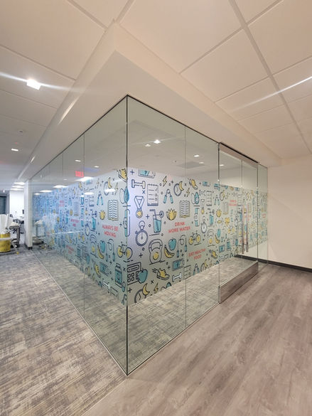corner office with windows wrapped in a frosted printed vinyl