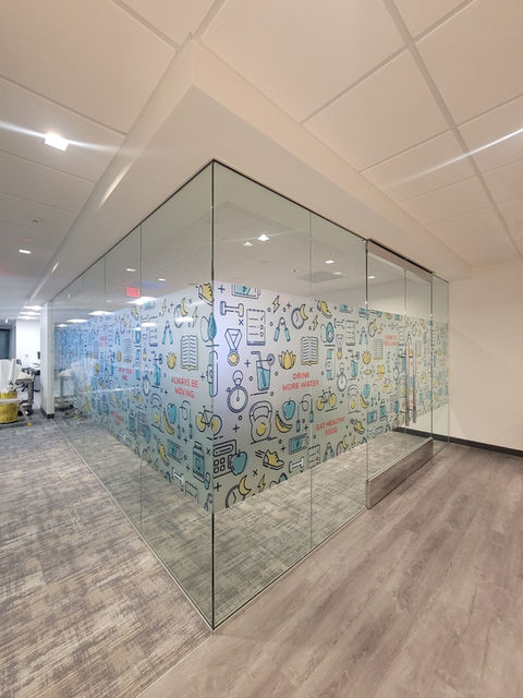 corner office with windows wrapped in a frosted printed vinyl