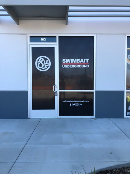 black and white window deals installed on business storefront windows and door