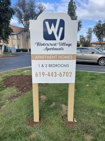 large community post and panel sign to showcase the amenities 