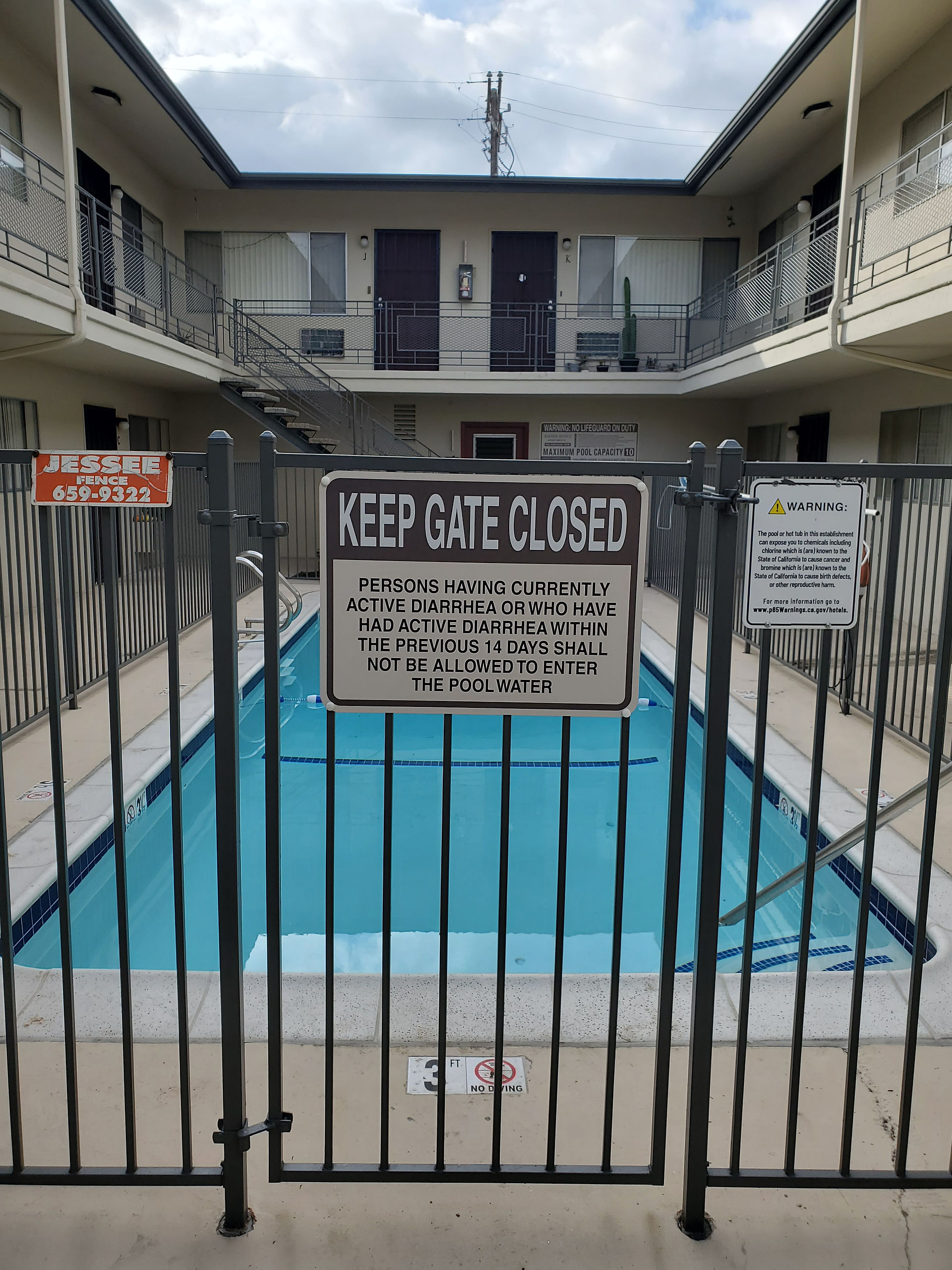 apartment keep gate closed signage for pool area