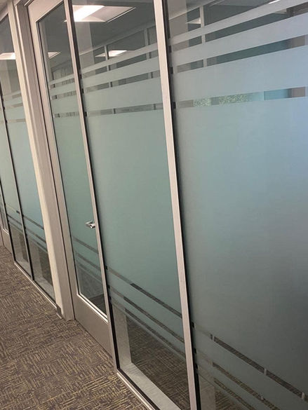Privacy glass on window and doors in office