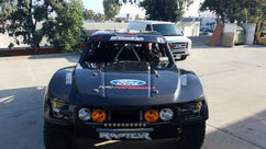 Sponsor decals applied to off-road race vehicle hood