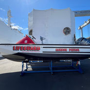 san diego marine wraps on a lifeguard boat in white and red.