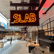 orange light up sign for restaurant