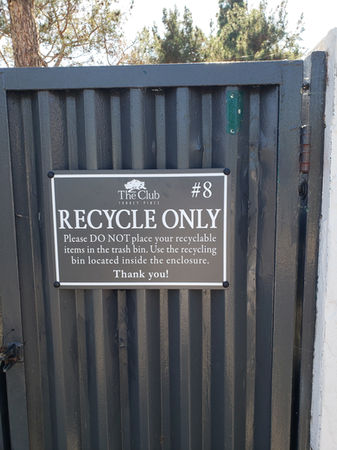Grey and white community recycling signage