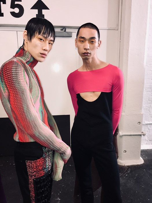 Two models wear Heo's colorful designs featuring cutouts and perforated fabrics
