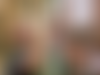 A man wearing glasses in a warehouse