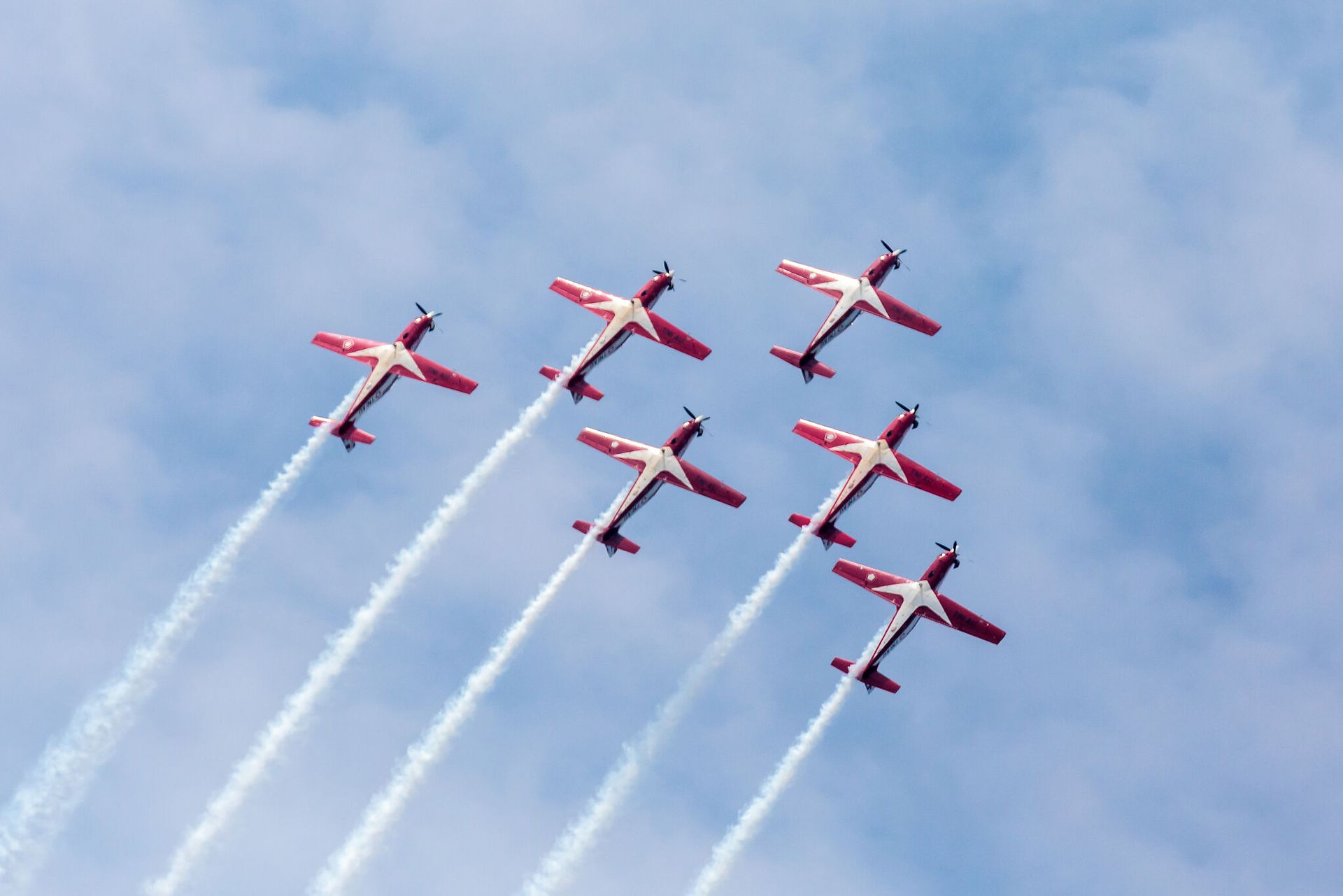 planes flying in the sky at Singapore Airshow