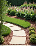 Team member planting flowers in a residential garden