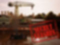 A screenshot from Team Junkfish game Bootleg Steamer. Image shows a crane on a dock, in the water is a little river steamboat. Text reads "Secret Stashes"