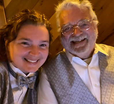 Amanda and James pose at indoor wedding Celebration