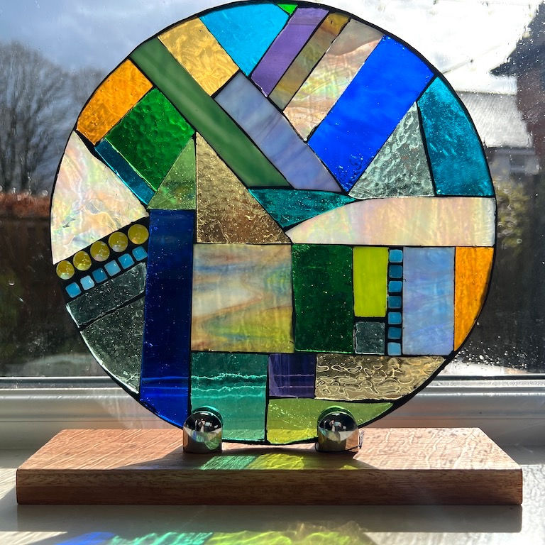 Thumbnail: Coastal Walk, Round Stained Glass Mosaic Panel with Stand
