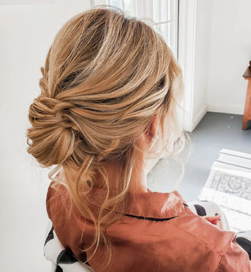 romantic soft updo for a bride or bridesmaid