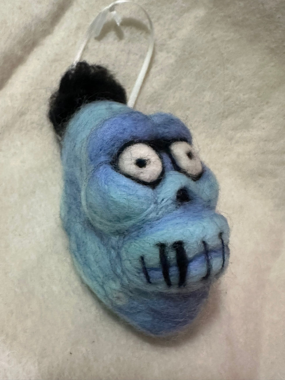 Thumbnail: Shrunken head hanging ornament