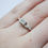 Thumbnail: Princess cut diamond ring with leaf detail shoulders