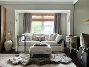 Cozy family room layered with woven wood window shades