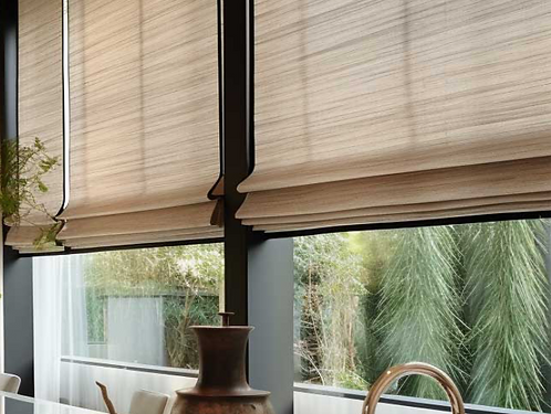 Motorized natural woven wood shades installed in Celina, Tx home for privacy and light control