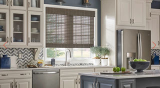 Dark woven wood shade over kitchen sink