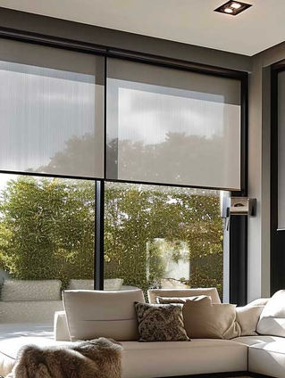 Light filtering solar shades installed on large modern windows in a North Texas home providing glare reduction UV protection and energy efficiency