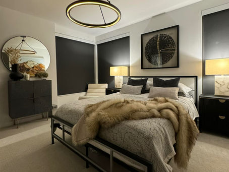 Custom motorized roller shades in a North Texas bedroom with blackout fabric for privacy, light control, and a clean modern design