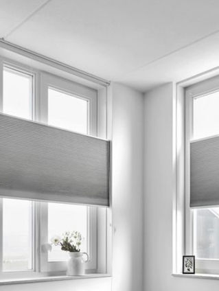 Custom honeycomb shades installed in a North Texas home providing energy-efficient insulation, privacy, and clean modern light control