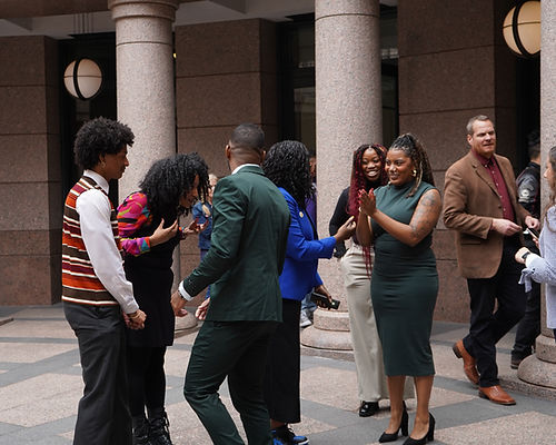 Poet House community members celebrating together at the Texas Capitol