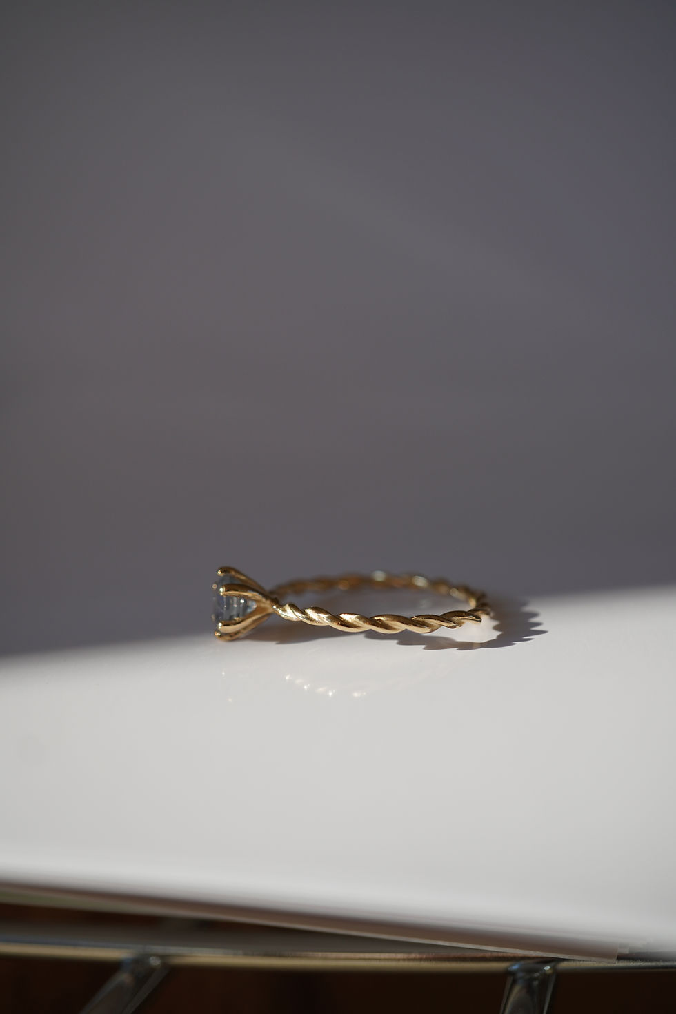 Thumbnail: twisted ring and light blue sapphire