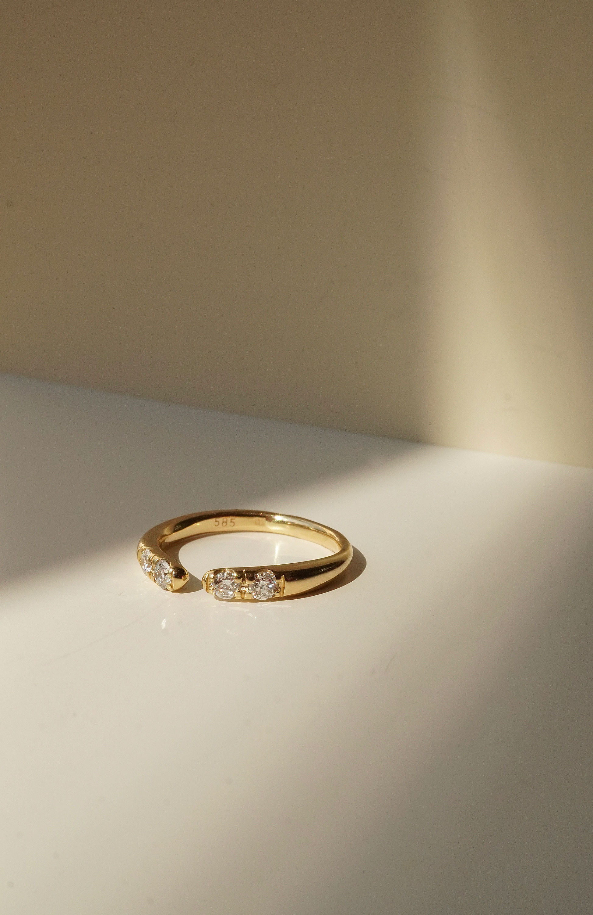 open ring and diamonds
