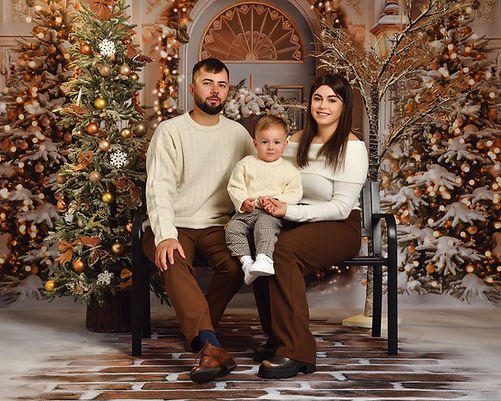 Family of three posing for the Christmas photos-min.jpg