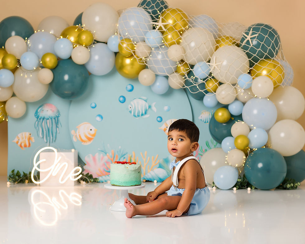Boy having first cake smash photoshoot to celebrate his birthday in Hemel Hempstead, Hertfordshire.