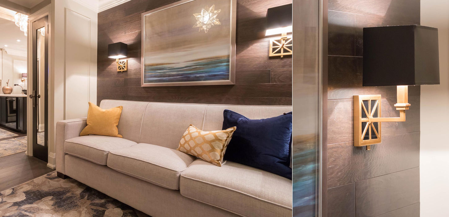 dramatic den with sconces and wood walls