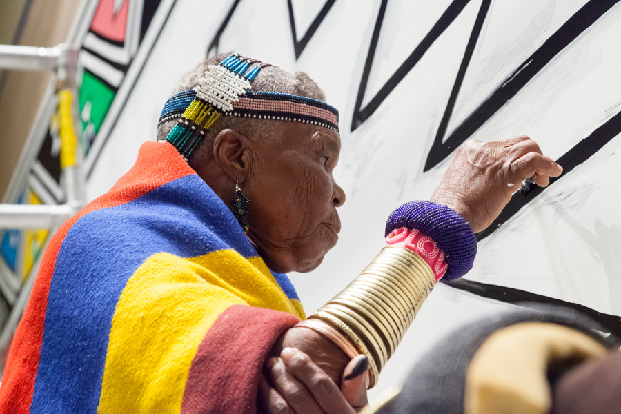 Dr Esther Mahlangu painting a mural during her residency at the Virginia Museum of Fine Arts, Richmond, 2014
