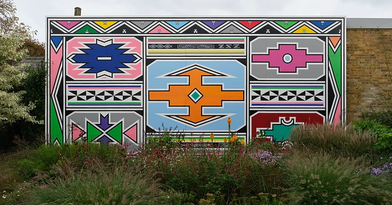 Dr Esther Mahlangu's large-scale Ndebele mural installed at Serpentine North, London, 2024