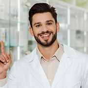stock-photo-handsome-pharmacist-smiling-camera-pointing.jfif