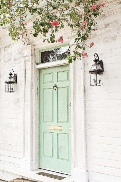 Interior design studio | Interior design blog | Interior designer | Mint green front door. Green door. Pink flowers and green foliage. Overhanging foliage,