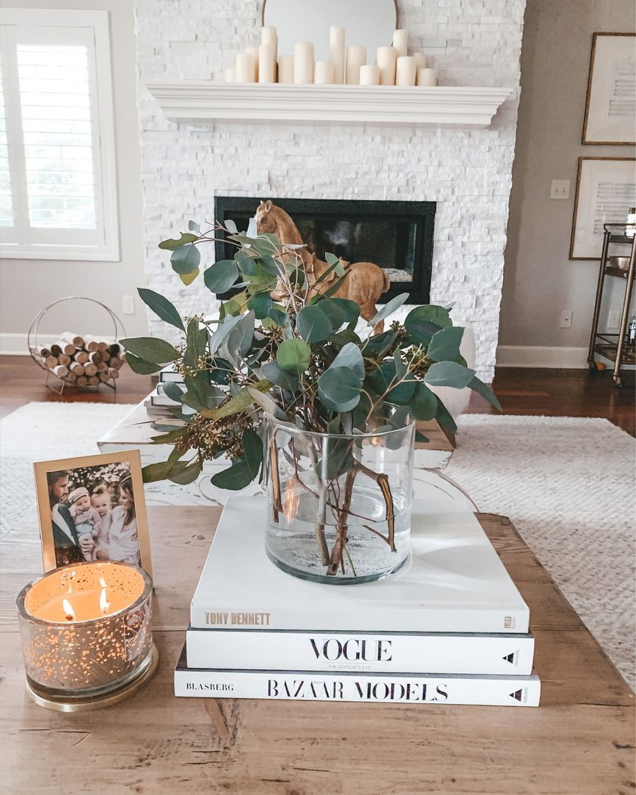 A stack of coffee table books can act as a great centrepiece for a coffee table with some accessories or a vase on top. Credit cellajaneblog
